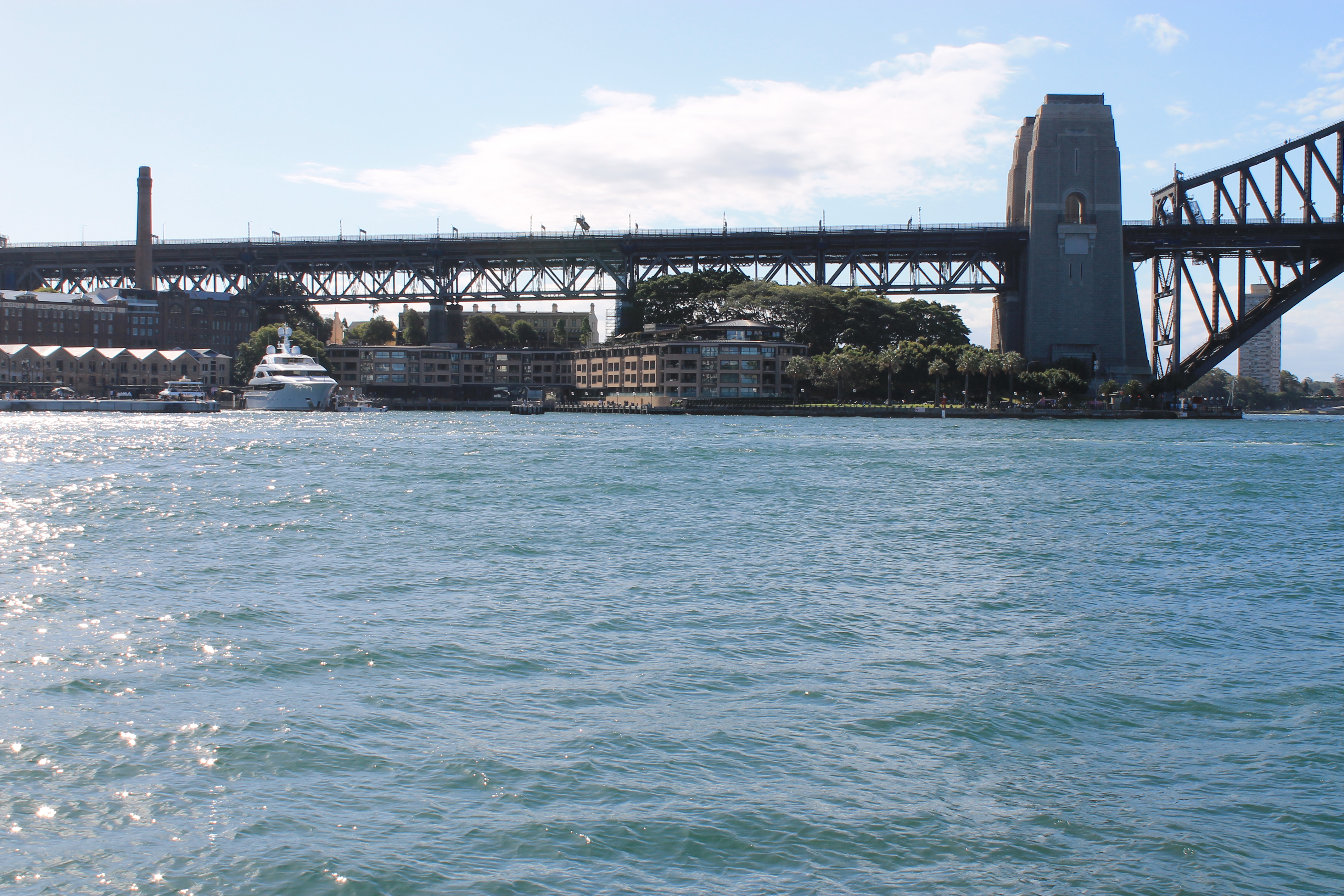 Luxury yacht docked on Sydney Harbour near the bridge